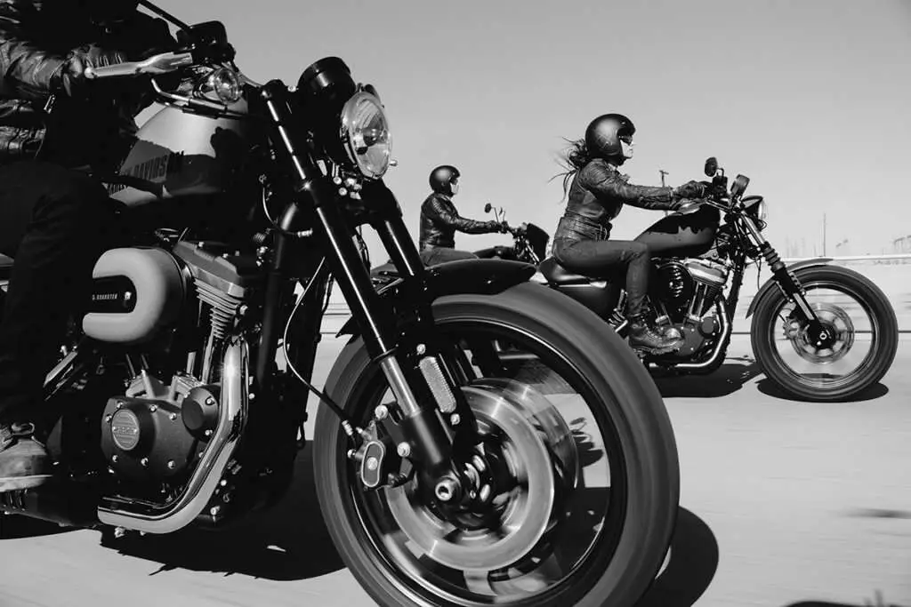 3 motorcycle riders in black & white