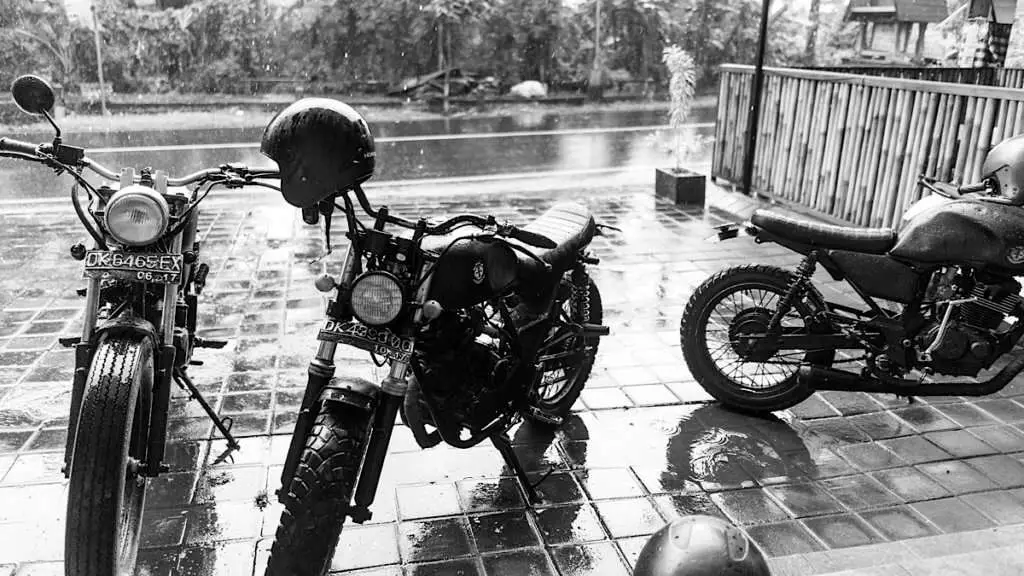 3 motorcycles in the rain