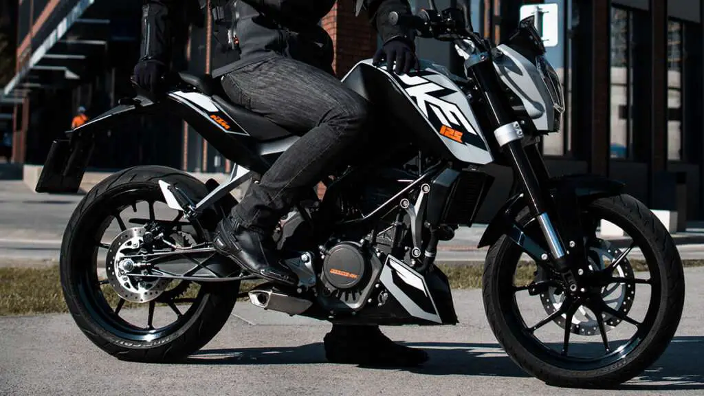 Black motorcycle boots on a KTM motorcycle