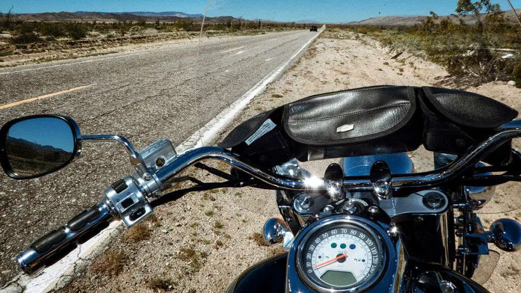 A motorcycle dashboard on the side of the road