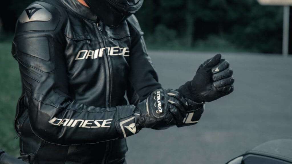 Man in black leather Dainese motorcycle jacker