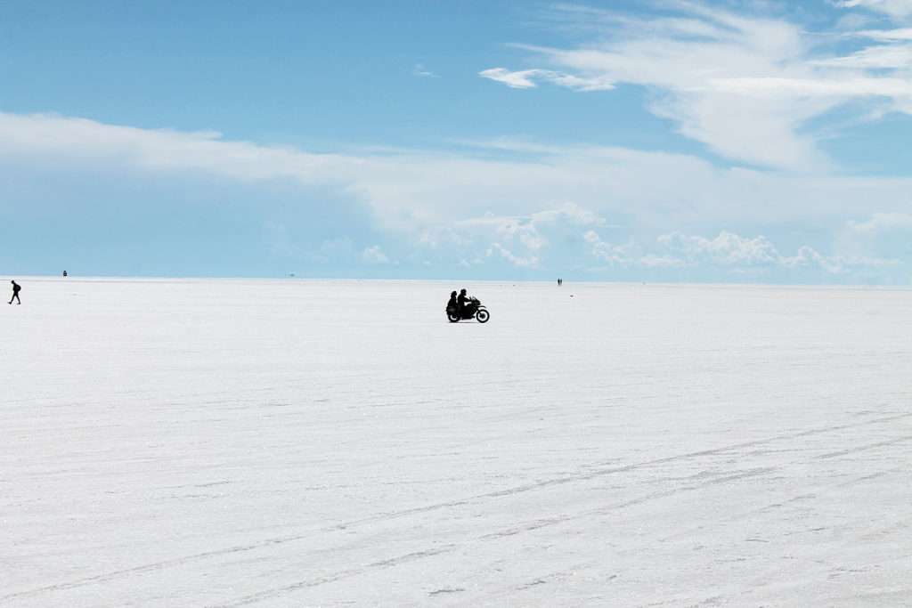 Motorcycle with two riders on an ice plain