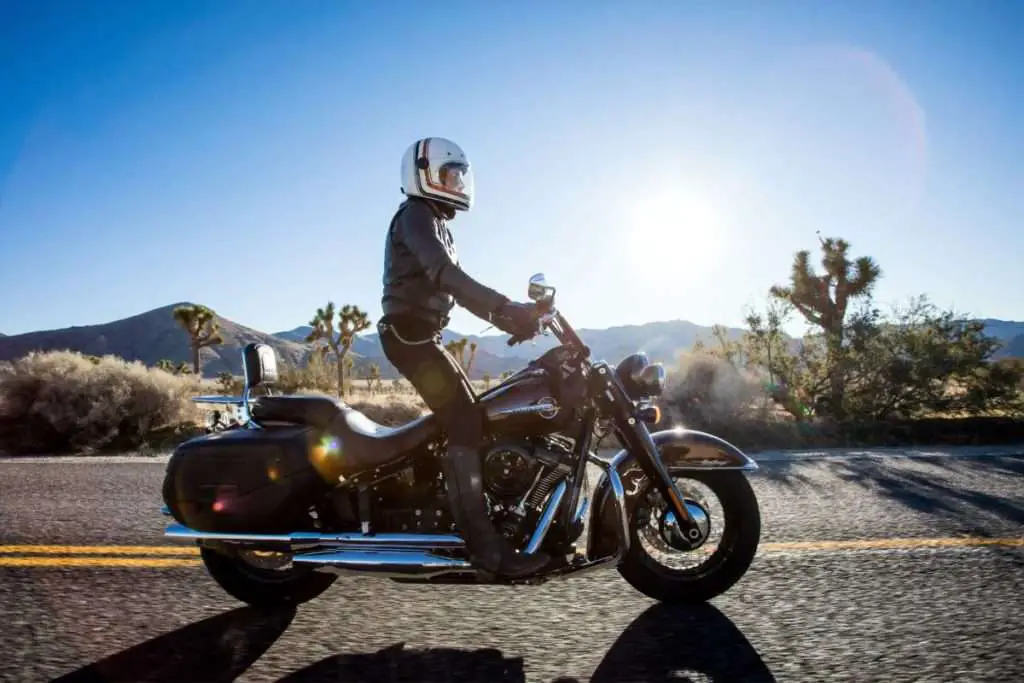 Man on black cruiser on highway