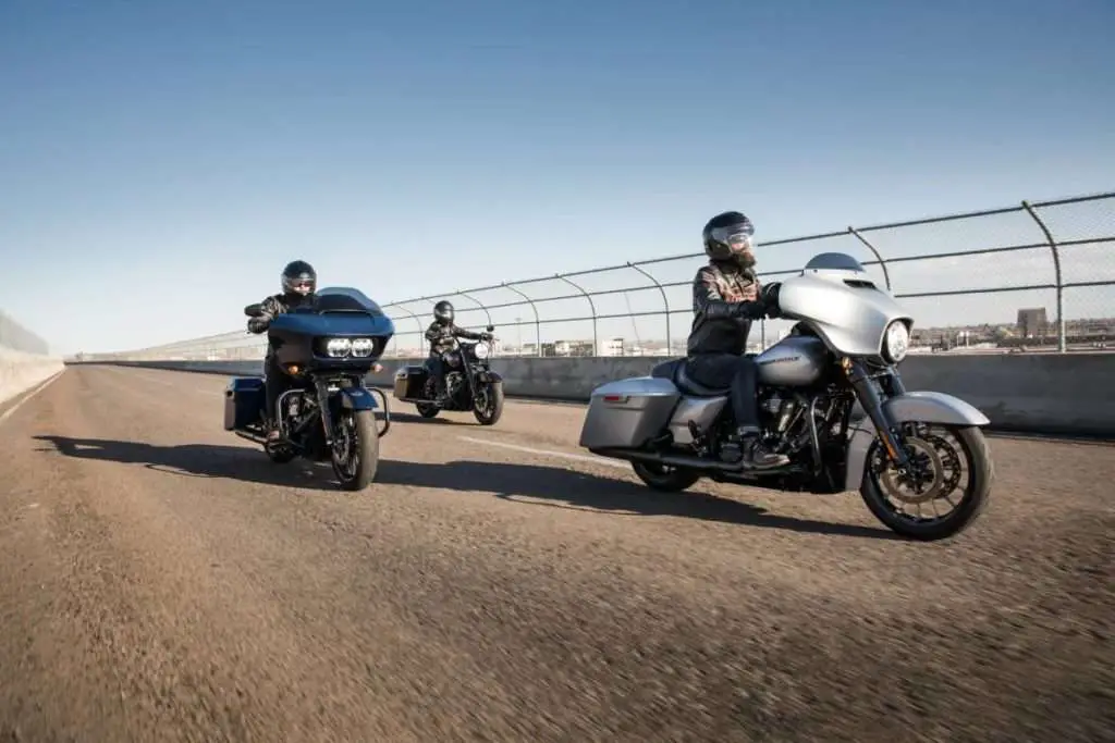 Three men riding touring motorcycles