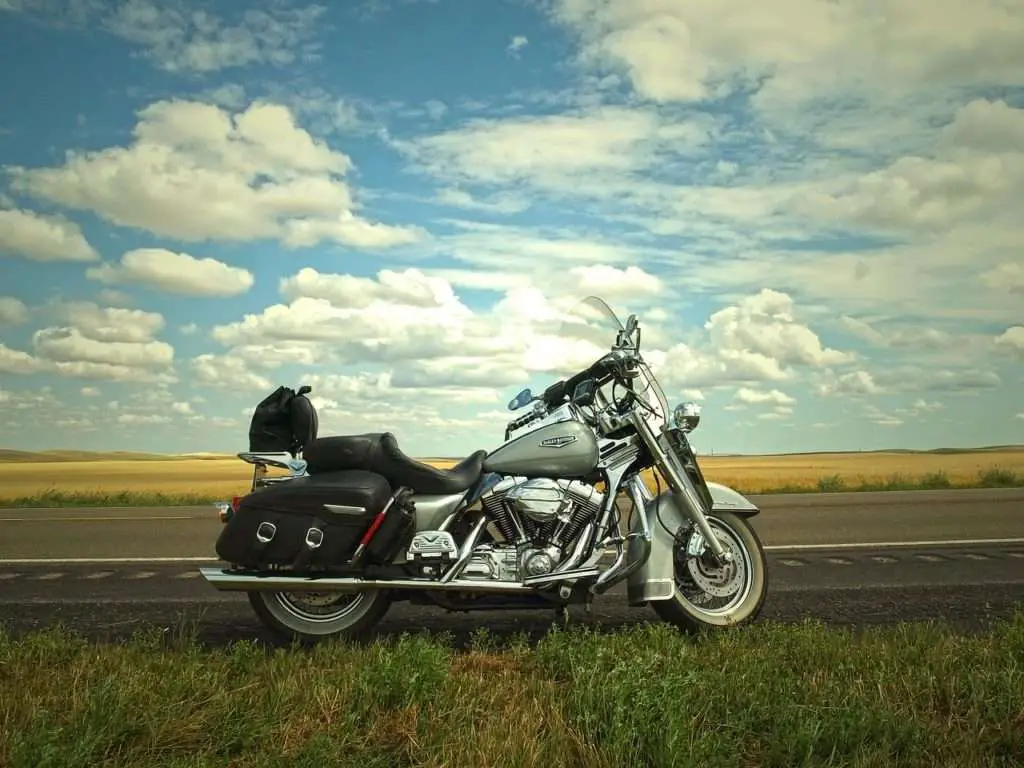 Grey motorcycle parked on the side of the road