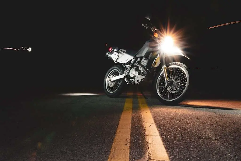Suzuki with light on in the night