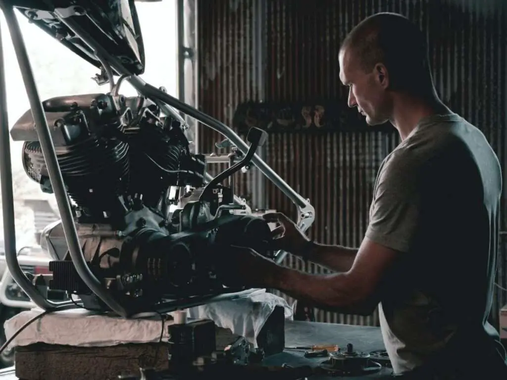 Man working on a motorcycle engine