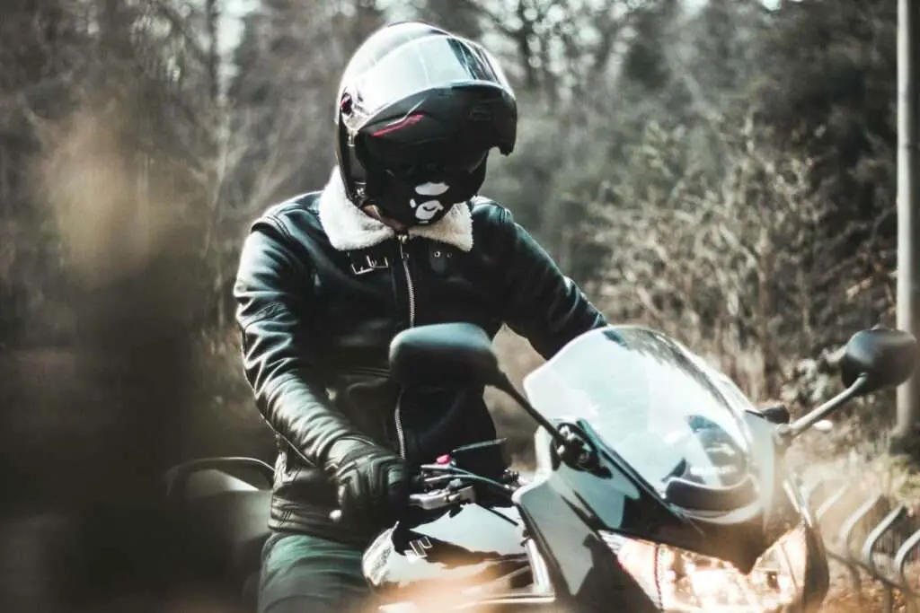 Man on motorcycle in black