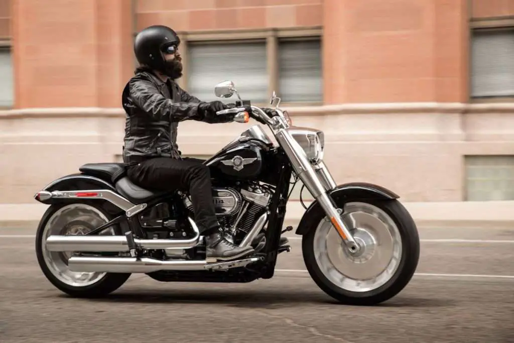 Black Harley-Davidson with rider with beard