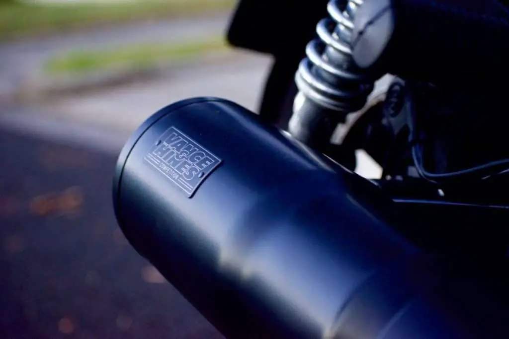 Close-up of a custom motorcycle exhaust wit the Vance & Hines logo