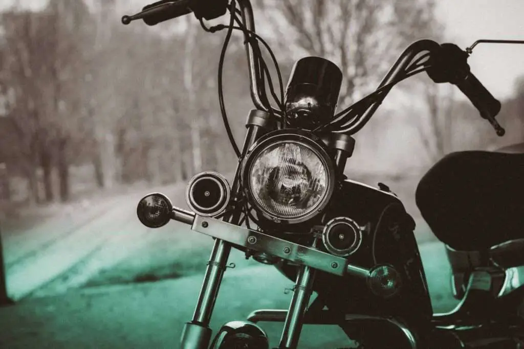 Motorcycle low rider headlight in a black and white photo