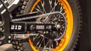 Motorcycle chain with an orange rim