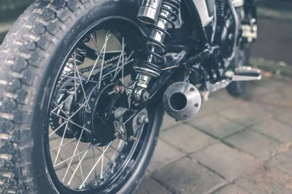 Rear of a motorcycle with the exhaust in focus