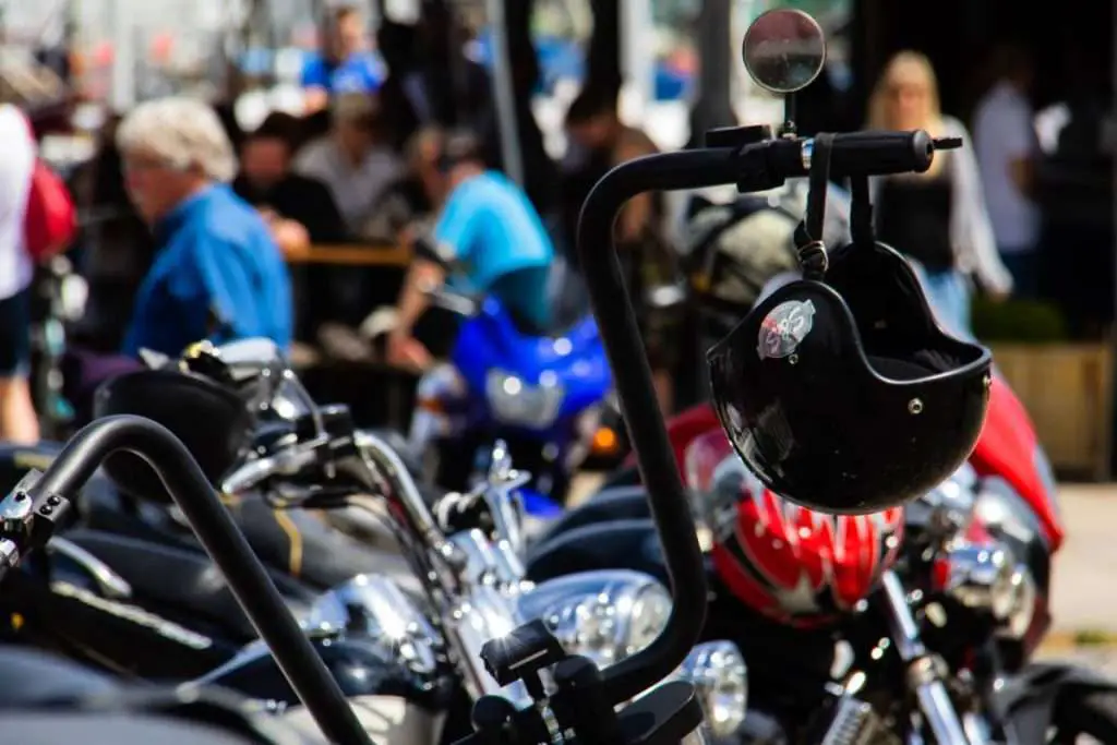 Black motorcycle handlebar with helmet hanging