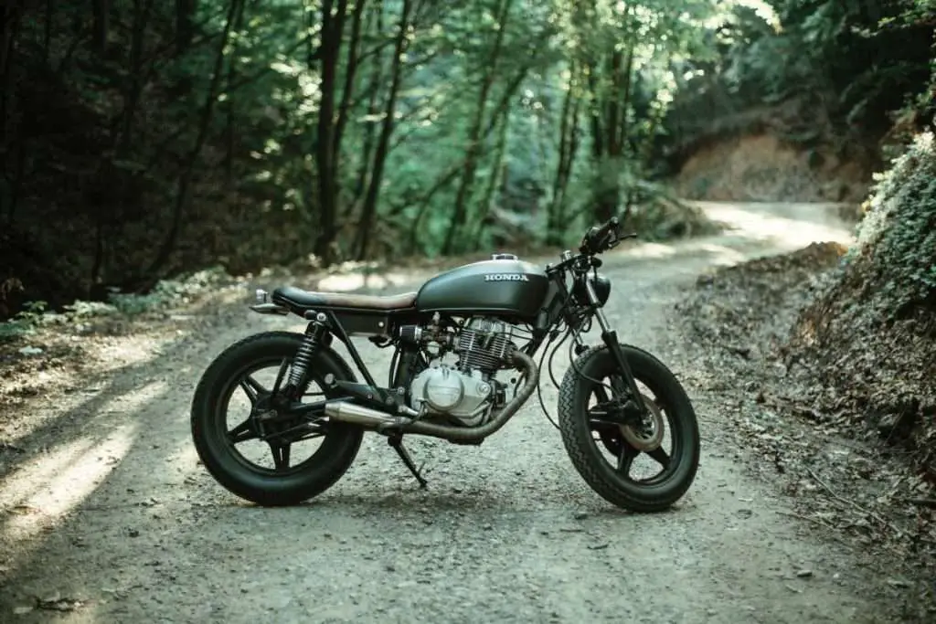 Honda cafe-racer motorcycle in the woods